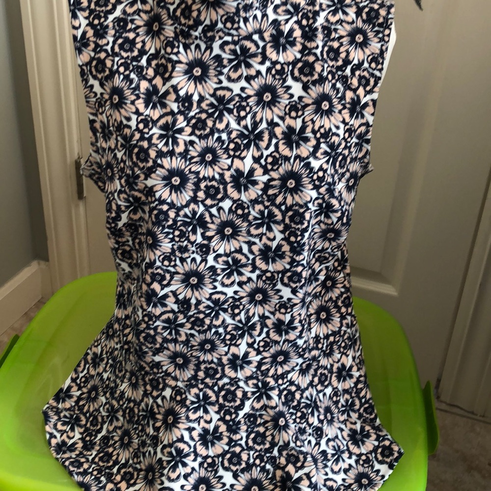 Peplum sleeveless blouse